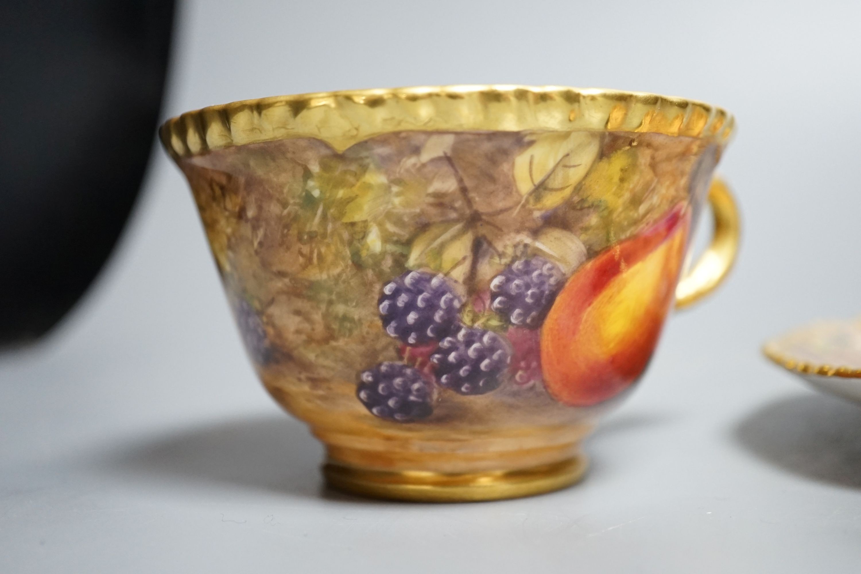 A Royal Worcester fruit painted large tea cup and saucer, signed P. Love, height 7cm overall